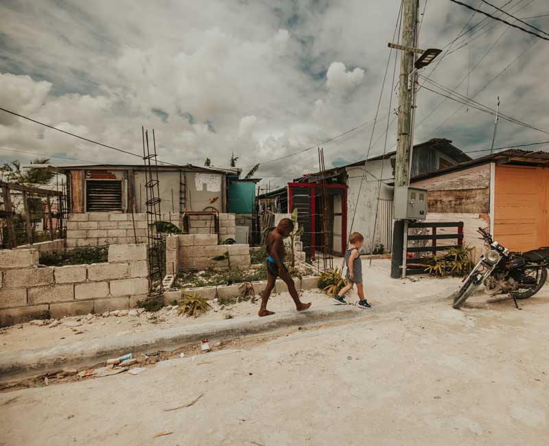 Children walking through a community served by GBL