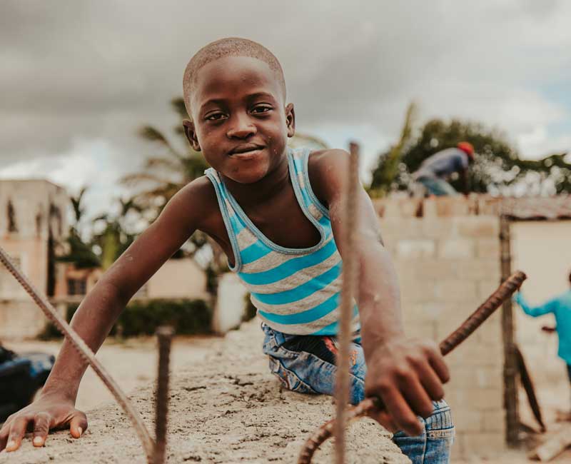 Child at a community construction project
